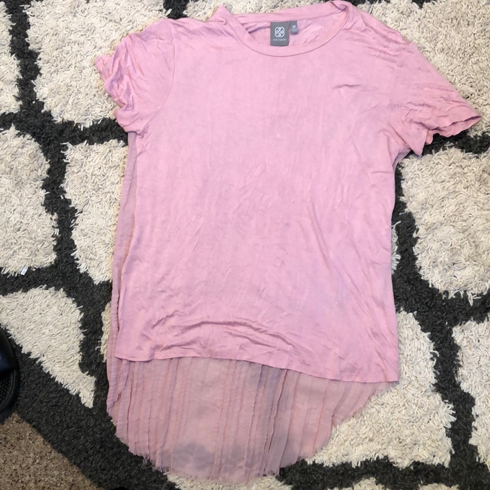 Blush shirt with accordion back.
